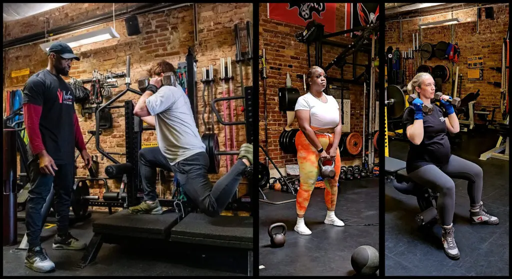 Three people are doing exercises in a gym.